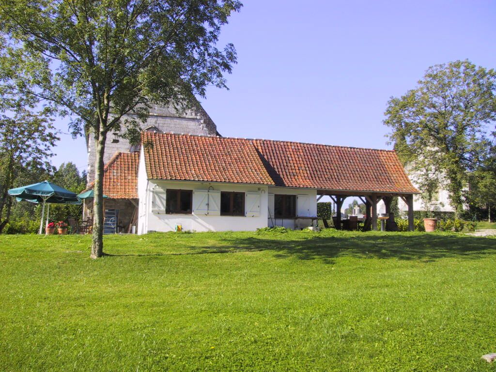 The kitchen wing and covered terrace from the garden