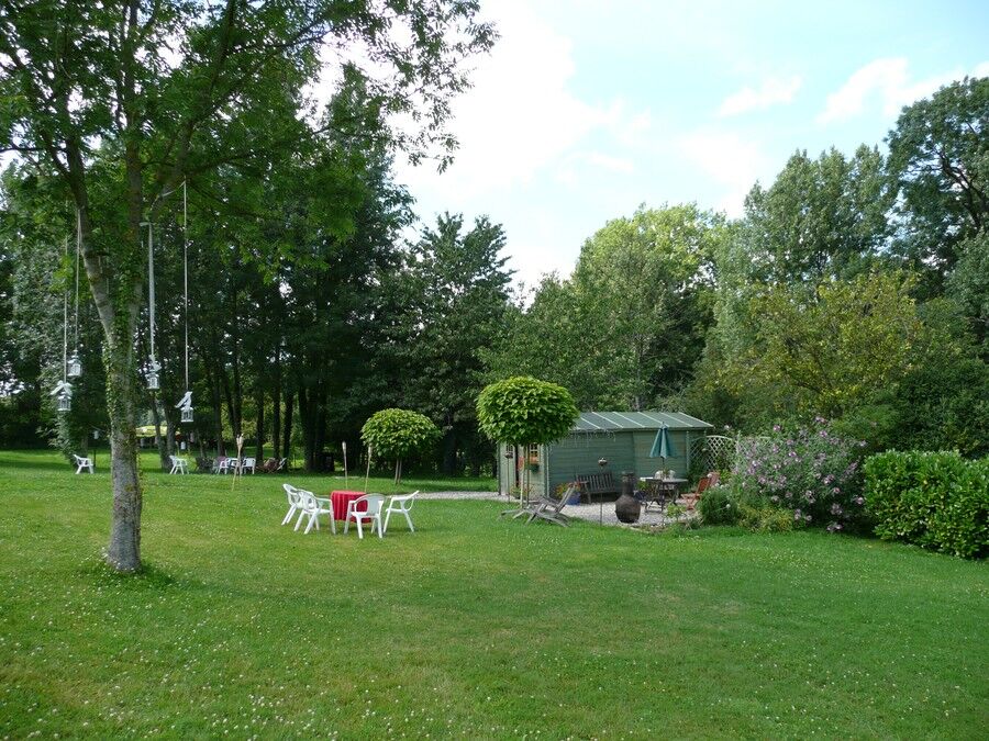 The lawn, with the shed and patio beyond